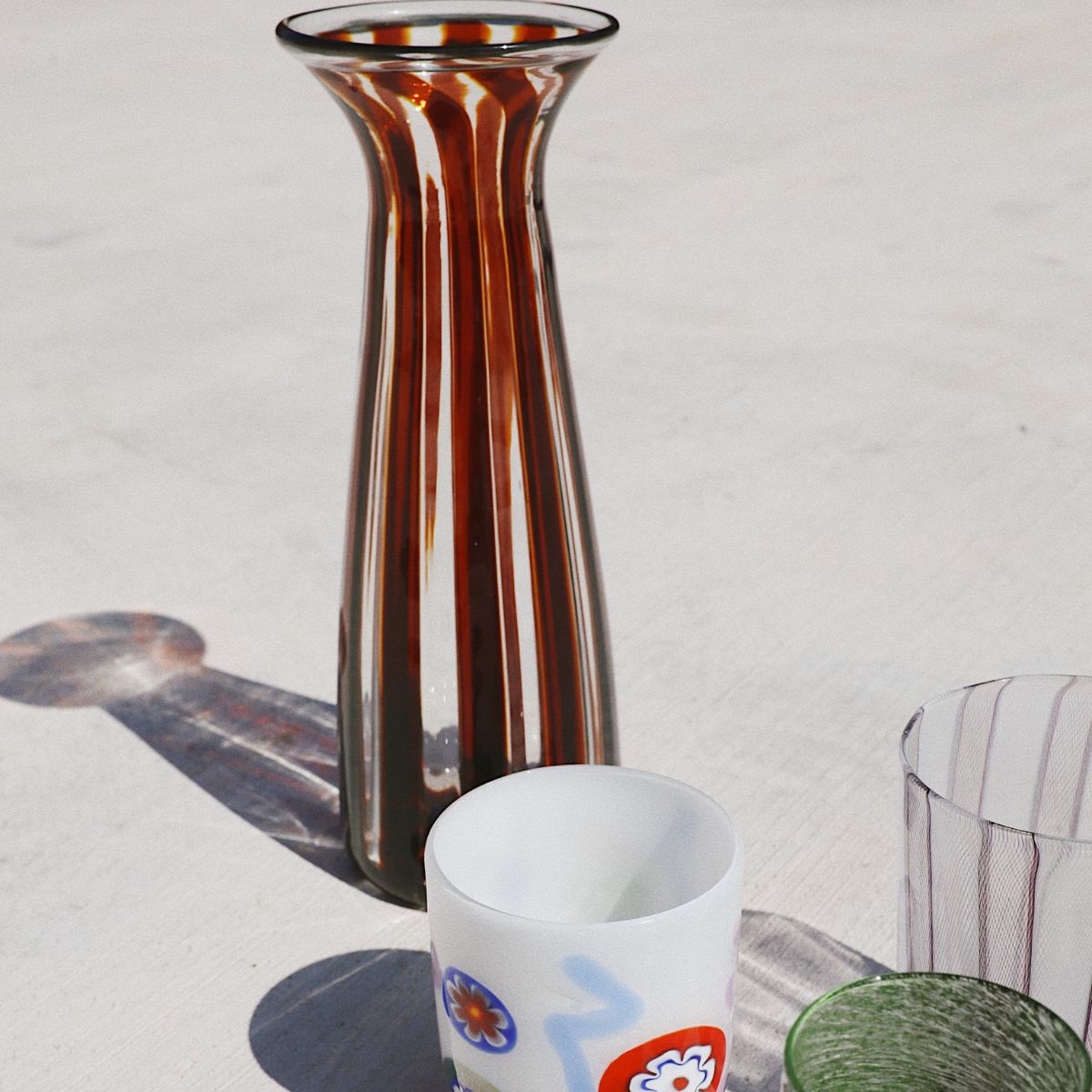 Variety of hand blown glasses and vases.