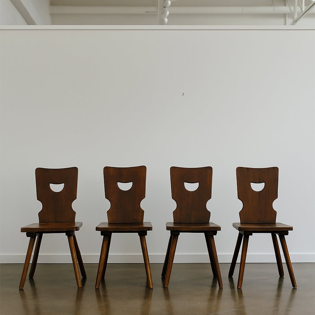 A Set of Four Brutalist Dining Chairs in the style of Torck