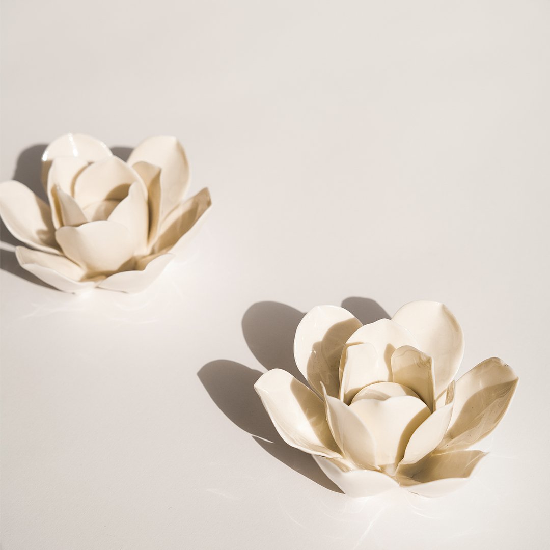 A Pair of Porcelain Lotus Candle Holders