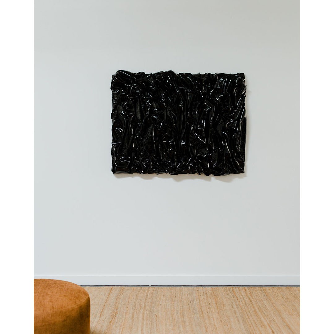Jason Adkins B-Real art piece styled on wall.
