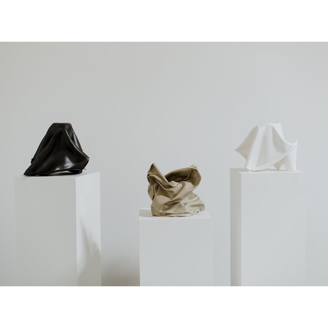 Three unique fold sculptures by Jason Adkins.