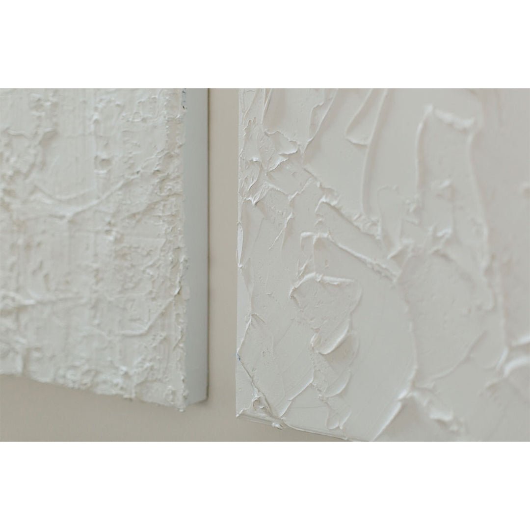 Pair of white textured Jason Adkins paintings.