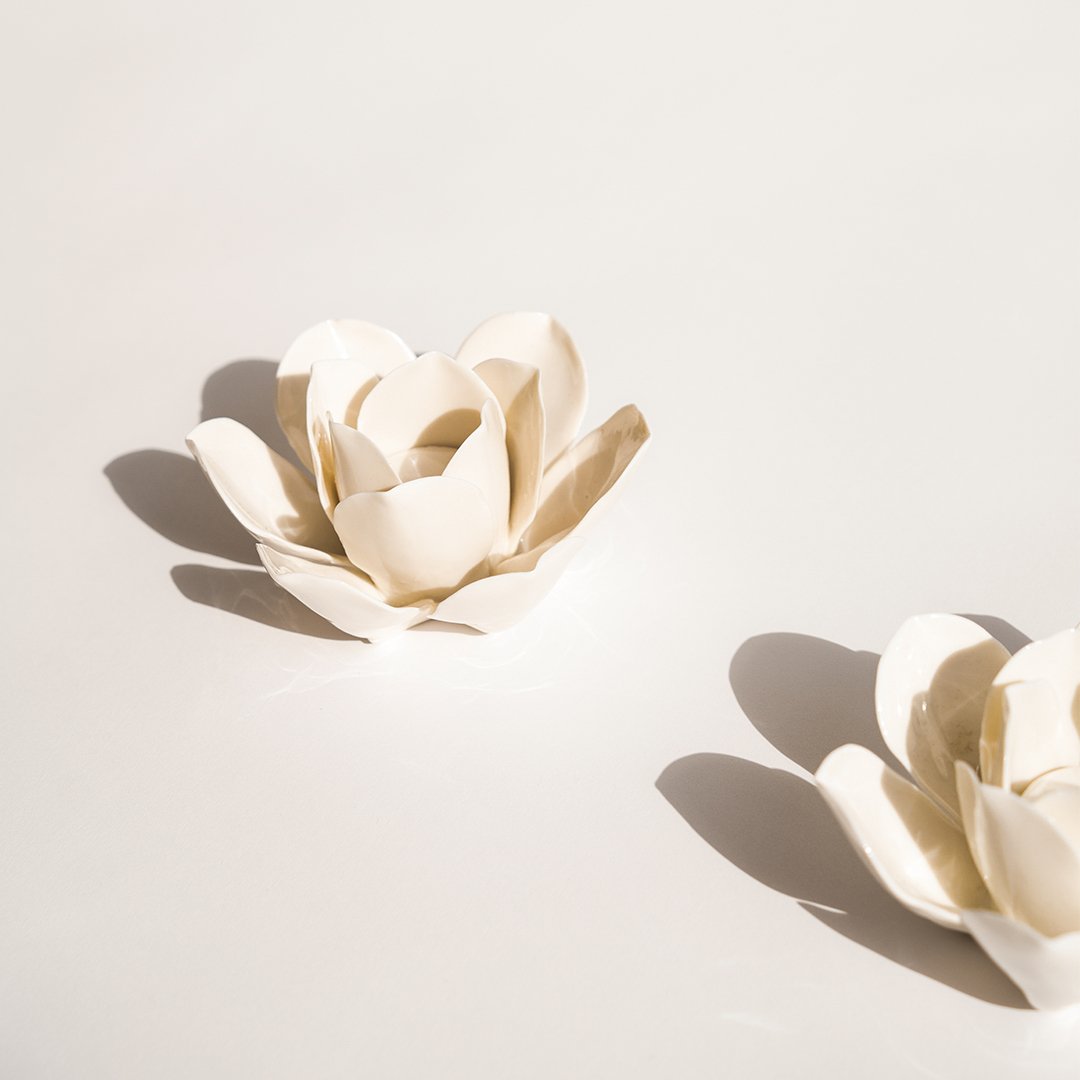 A Pair of Porcelain Lotus Candle Holders